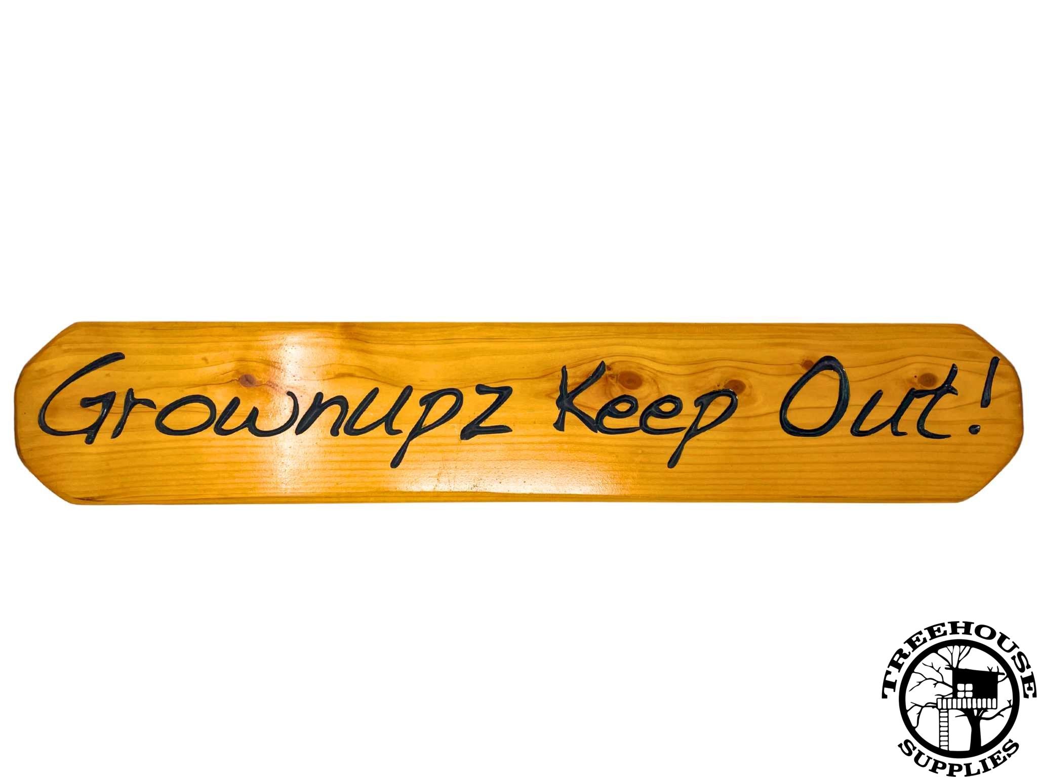 Two-foot-long wooden sign with lettering. Engraved or carved text states Grownupz Keep Out! White Background. 